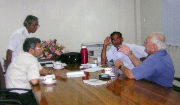 P G Joseph (half standing) engaged in a discussion with Ray Wijewardene (extreme right)