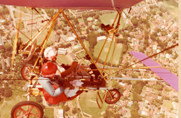 Ray Wijwardene flying an auto gyro; birds eye view of an aviator