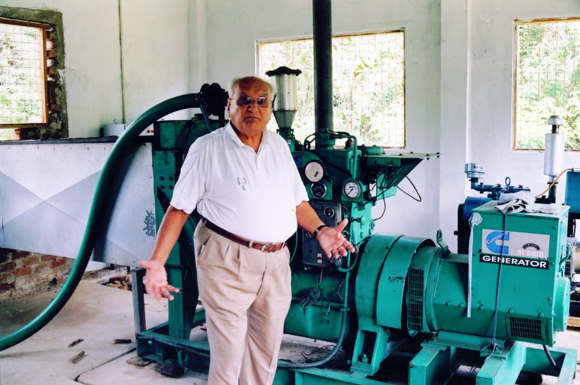 Ray Wijewardene displaying a small scale gasifier in his own estate 